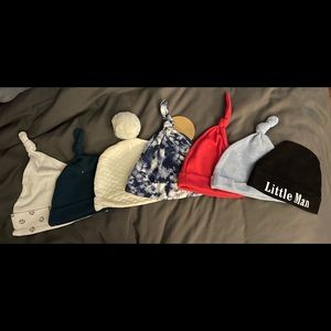 7 assorted baby hats. Size 0-6 months.